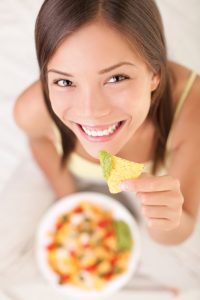Woman eating nachos